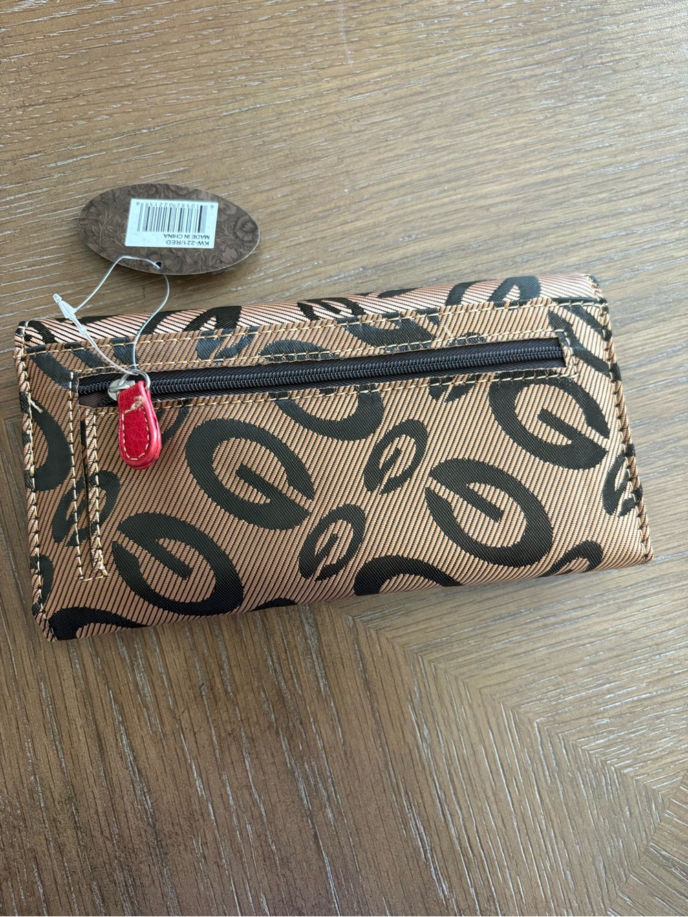 Guess Tan Wallet with Black Logo Circles and Red Zip Pull